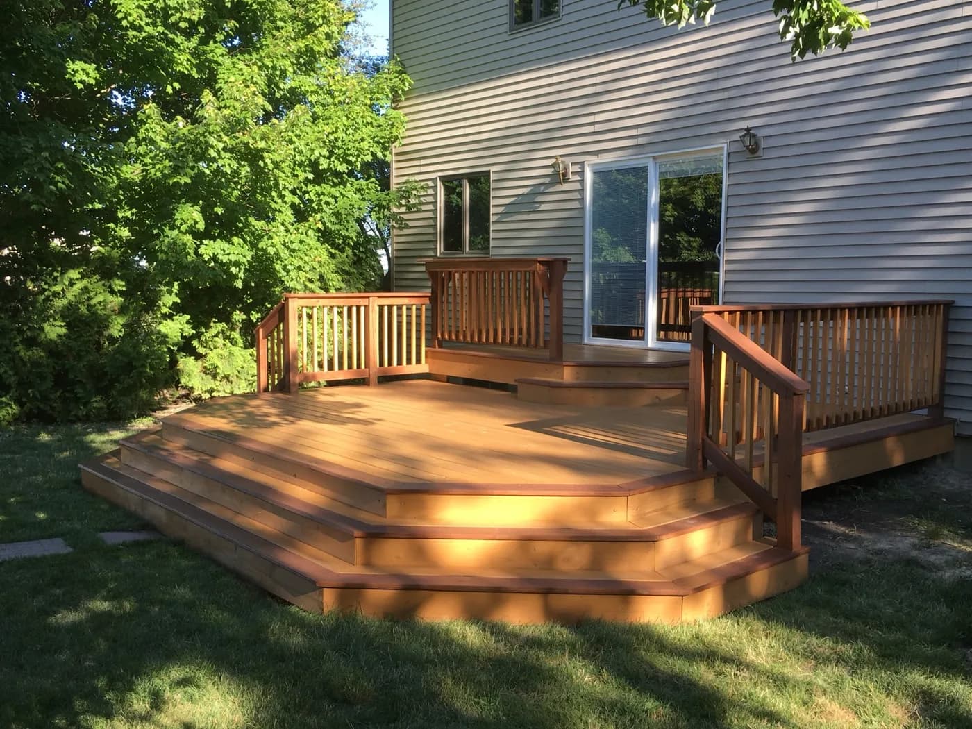 Cedar deck with integrated step lighting at dusk
