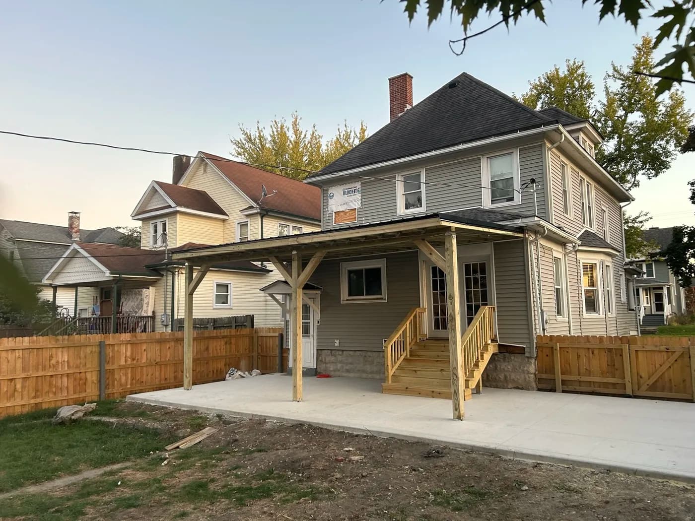 Covered front porch with timber posts and new concrete pad