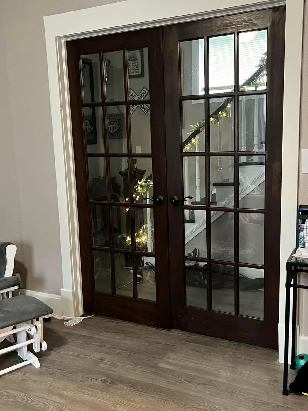 Custom French doors with dark wood stain and glass panes