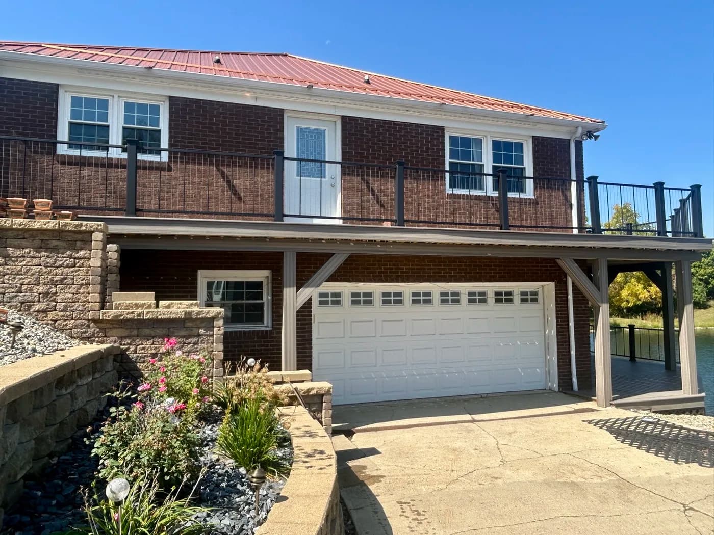 Brick lakehouse with new upper and lower composite decks
